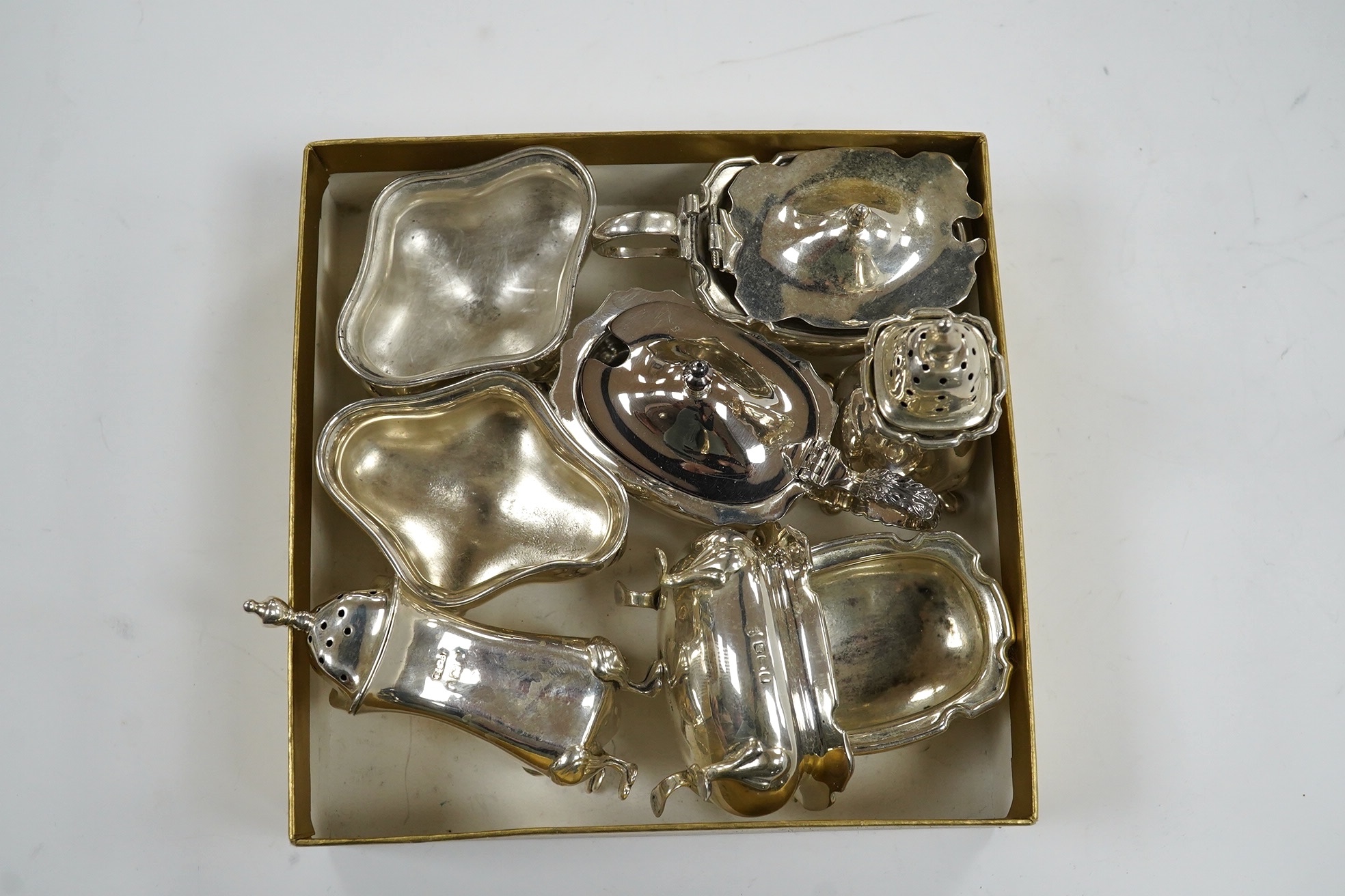 Eight assorted silver cruets including salts and mustard pots, various dates and makers, Condition - poor to fair